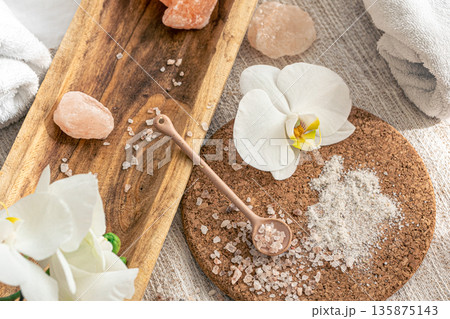 Spa composition with sea salt and orchid flowers. 135875143