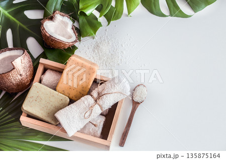 Spa composition with tropical leaves on white background Spa composition with tropical leaves on white background 135875164