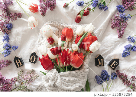 Spring flower composition on a white background, top view. Spring flower composition on a white background, top view. 135875284