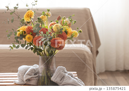 Bouquet of chrysanthemums in a vase in the interior of the room, copy space. 135875421