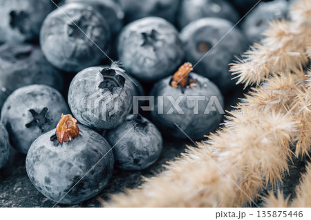 Wet ripe blueberries close up, macro shot. 135875446