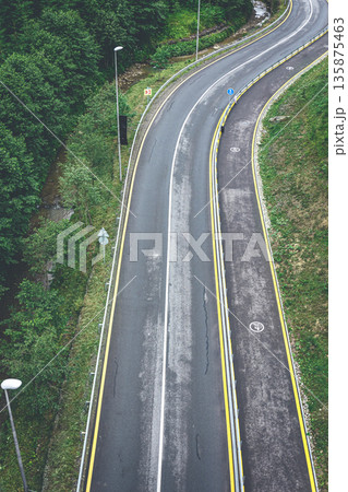 Winding road in the mountains, top view. 135875463