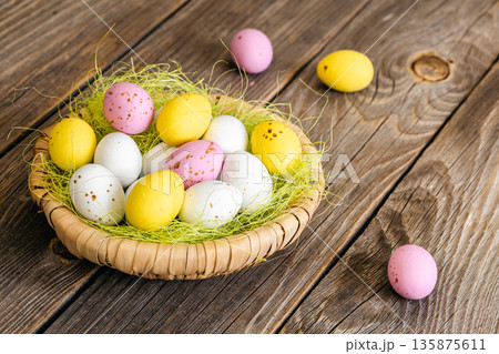 Easter composition with eggs in a decorative nest. Easter composition with eggs in a decorative nest. 135875611
