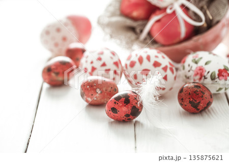 Easter eggs on a light wood background, Easter eggs on a light wood background, 135875621