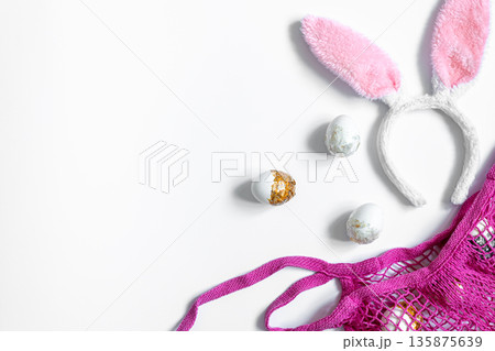 Festive Easter background with eggs and string bag, copy space. Festive Easter background with eggs and string bag, copy space. 135875639