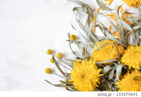 Autumn flat lay composition with sunflowers on a white background. Autumn flat lay composition with sunflowers on a white background. 135875641