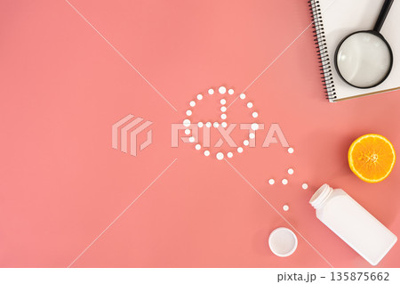 Flat lay, pills on a pink background, conceptual minimalism, medicine. 135875662