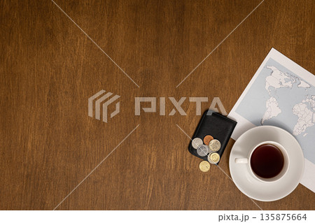 Flat lay travel composition with world map on wooden background. 135875664