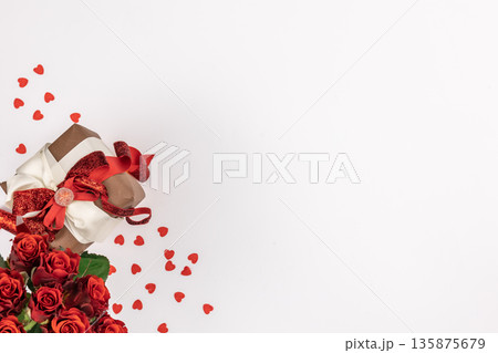 Flat lay, white background with gift box and valentine's day decor details. 135875679