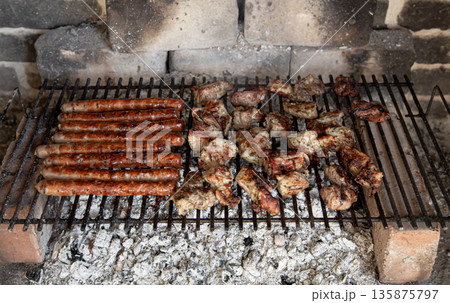 Homemade barbecue in nature. Roasting meat on a grid. 135875797