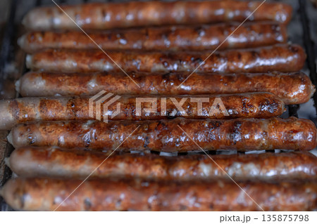 Homemade barbecue in nature. Roasting meat on a grid. 135875798