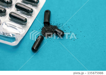 Pills on a blue background, close-up, medicine concept. Pills on a blue background, close-up, medicine concept. 135875986