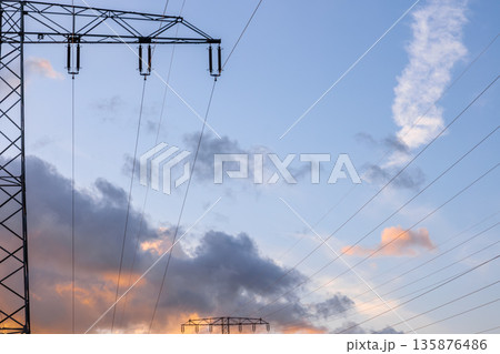 Clouds and power lines. High voltage infrastructure. Electricity in nature Clouds and power lines. High voltage infrastructure. Electricity in nature 135876486