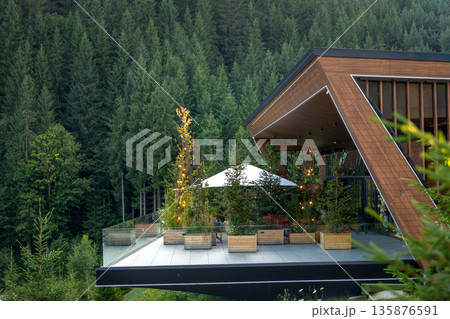 Modern wooden house in the mountains. Terrace with panoramic view 135876591