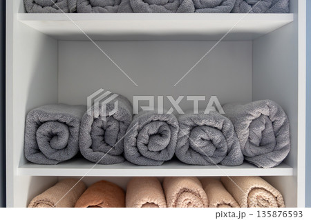 Monochrome grey towels on spa shelf. Grey towels. 135876593