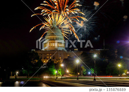 Fireworks burst above Capitol building as people enjoy celebration on Independence day night in Washington D.C. Fireworks burst above Capitol building as people enjoy celebration on Independence day night in Washington D.C. 135876889