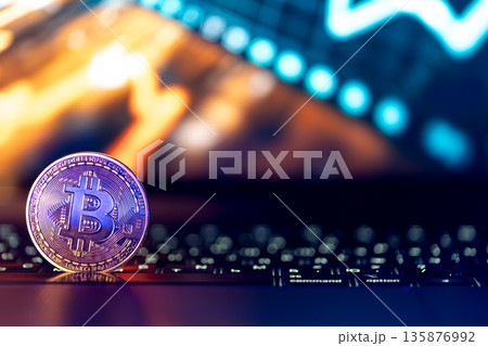 Bitcoin coin on keyboard with nice background. Crypto money concept. Bitcoin coin on keyboard with nice background. Crypto money concept. 135876992