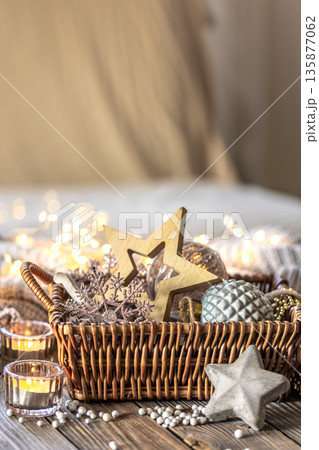 Christmas decorations in a basket. Composition with Christmas decorations. 135877062