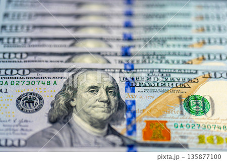 Close-up image of Benjamin Franklin on 100 bill. Finance concept. Close-up image of Benjamin Franklin on 100 bill. Finance concept. 135877100