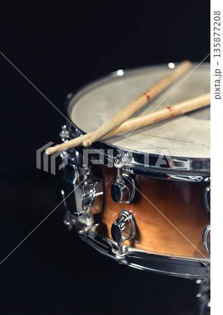 Drum close-up. Drumsticks with a drum. 135877208