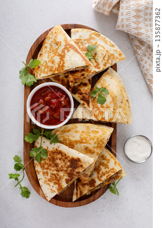 Ground turkey and cheddar quesadillas with salsa 135877362