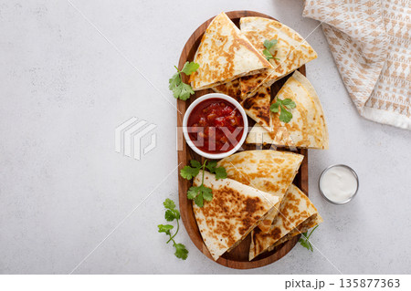 Ground turkey and cheddar quesadillas with salsa 135877363