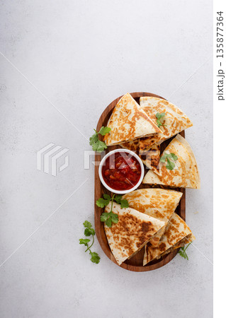 Ground turkey and cheddar quesadillas with salsa 135877364