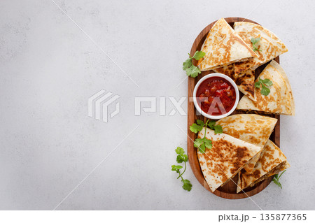 Ground turkey and cheddar quesadillas with salsa 135877365