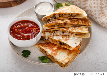 Ground turkey and cheddar quesadillas with salsa Ground turkey and cheddar quesadillas with salsa 135877371