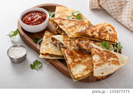 Ground turkey and cheddar quesadillas with salsa Ground turkey and cheddar quesadillas with salsa 135877373