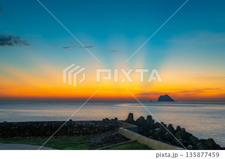 Sunrise over Keelung Islet with Colorful Summer Sky and Calm Sea in Waimushan. 135877459