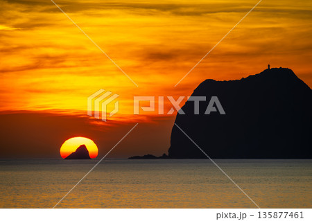 Keelung Islet Waimushan Taiwan Sunrise Golden Sun Ocean Lighthouse Silhouette. Keelung Islet Waimushan Taiwan Sunrise Golden Sun Ocean Lighthouse Silhouette. 135877461