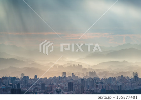 Dramatic Crepuscular Rays Shine Over Taipei City from Dadao Mountain. Dramatic Crepuscular Rays Shine Over Taipei City from Dadao Mountain. 135877481