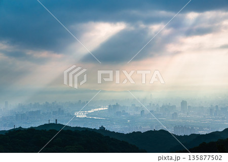 Serene Sunrise God Rays over Dadao Mountain Shulin Taiwan Sky. Serene Sunrise God Rays over Dadao Mountain Shulin Taiwan Sky. 135877502