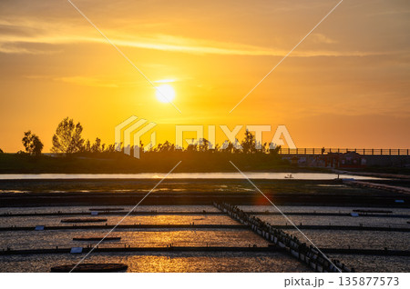 Beimen Salt Field Taiwan Sunset Serenity with Dramatic Rays. 135877573