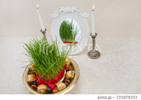 Nowruz haft-sin table setting celebrating persian new year Nowruz haft-sin table setting celebrating persian new year 135879332