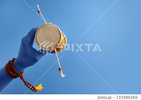 Maha Shivratri. Blue Lord Shiva hand holding damru with rudraksha mala Maha Shivratri. Blue Lord Shiva hand holding damru with rudraksha mala 135880260
