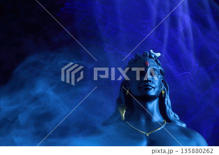 Maha Shivratri background. Lord shiva adiyogi meditating in divine blue light 135880262