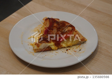 top view hot crab stick and pineapple pizza and topped with ketchup in a white ceramic plate on a wooden table background, food, copy space top view hot crab stick and pineapple pizza and topped with ketchup in a white ceramic plate on a wooden table background, food, copy space 135880566