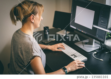 Female works on computer Female works on computer 135881101