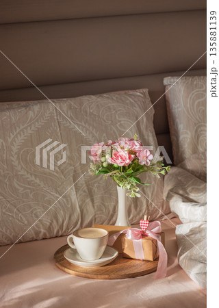 Romantic Breakfast in Bed with Coffee and Flowers. Cozy Valentines Day Lifestyle Romantic Breakfast in Bed with Coffee and Flowers. Cozy Valentines Day Lifestyle 135881139