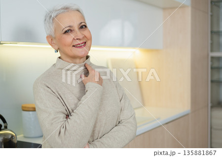 Portrait of confident stylish European middle aged senior woman. Older mature 60s lady smiling at home. Happy attractive senior female looking camera close up face headshot portrait. Happy people 135881867