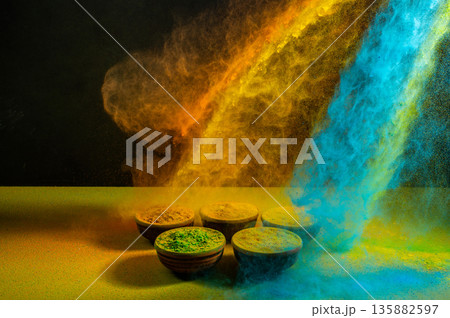 colorful rainbow holi paint color powder explosion isolated on dark black background. colorful rainbow holi paint color powder explosion isolated on dark black background. 135882597