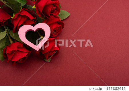 Pink Heart Shapes on Red Background with Copy Space Valentines Day Love Concept 135882613