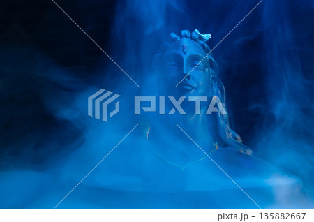 Maha Shivratri, Lord Shiva on blue, colorful mistic trance background. Maha Shivratri, Lord Shiva on blue, colorful mistic trance background. 135882667