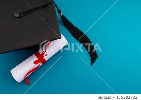 A symbolic representation of global education, graduation. graduation cap, books, globe and diploma on a colorful background. A symbolic representation of global education, graduation. graduation cap, books, globe and diploma on a colorful background. 135882732