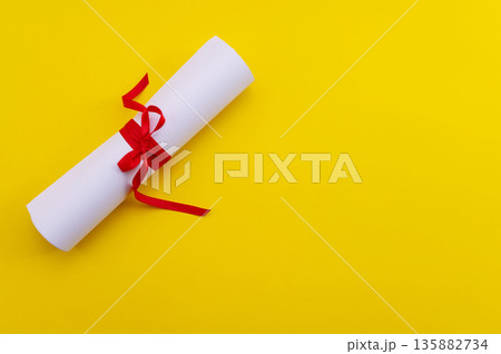 A symbolic representation of global education, graduation. graduation cap, books, globe and diploma on a colorful background. 135882734
