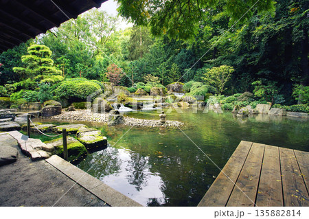 Japanese Garden in Augsburg: pond, pavilion, cascade of waterfall 135882814