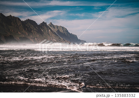 Playa del Roque de las Bodegas beach on Tenerife with ocean waves and cliffs 135883332