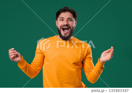 Amazed Man Shocked, Wow. Handsome Mature Guy Surprised To Camera on Green 135883387